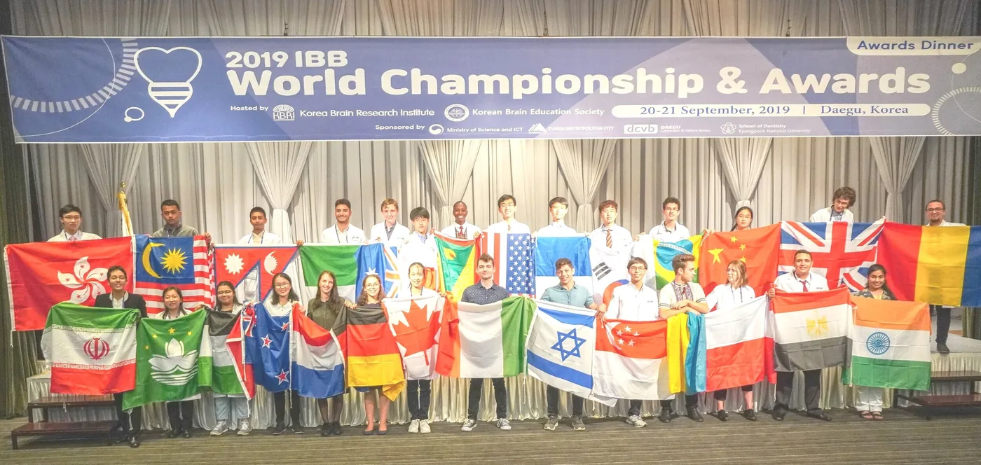 International Brain Bee national champions holding their countries' flags at the 2019 World Championship